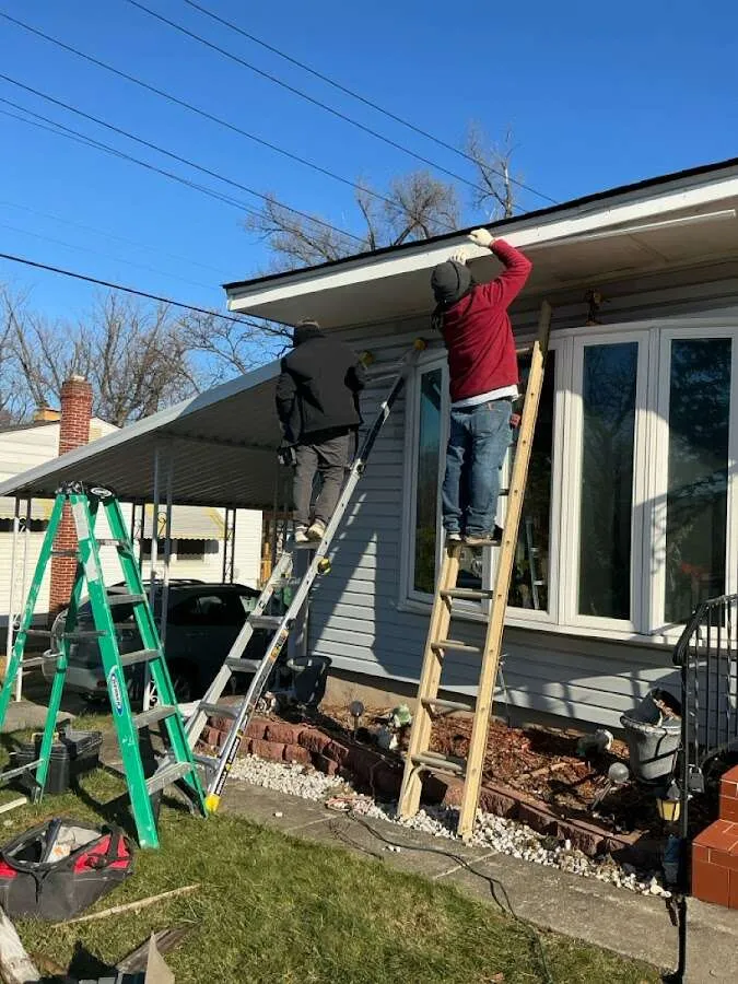 Restoration crew performing exterior repair in Candlewick Lake